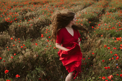 Woman running on field