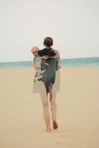 Multiple image of woman carrying baby boy at beach