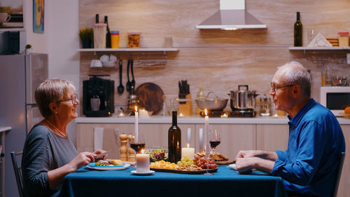 Side view of business colleagues working at table