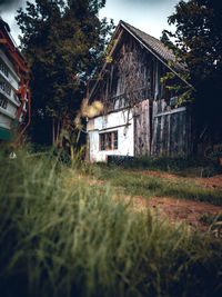 Old wooden house on field