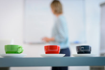 Close-up rear view of boy on table