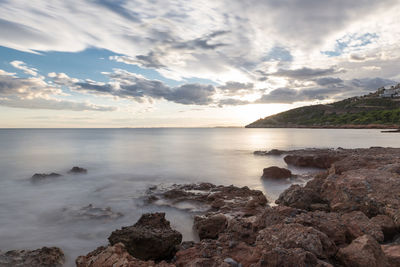 Scenic view of sea against sky at sunset