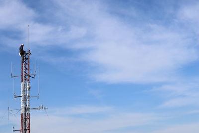 Low angle view of windmill against sky