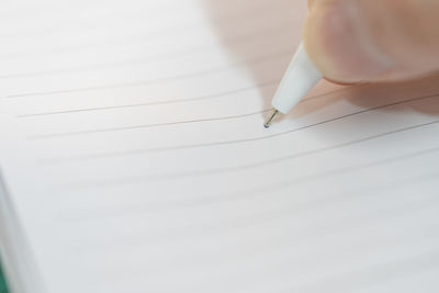 Close-up of hand holding paper