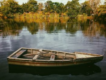 Boats moored in lake