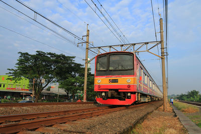 Train on railroad track against sky