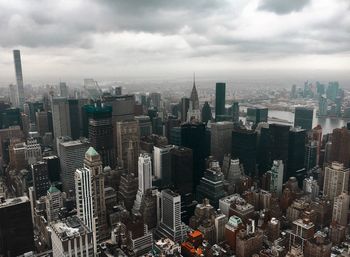 High angle view of modern buildings in city against sky