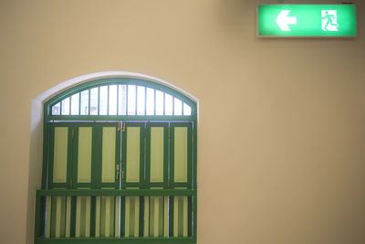 Illuminated sign on wall