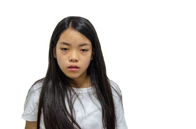 Portrait of a teenage girl against white background