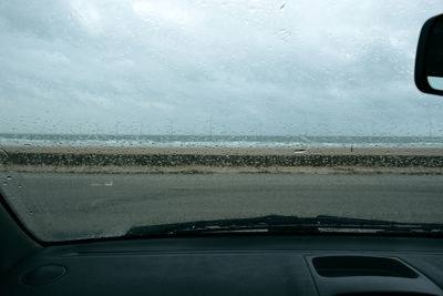 Raindrops on glass window of car