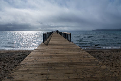 Pier over sea against sky