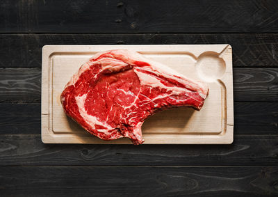 High angle view of meat on cutting board