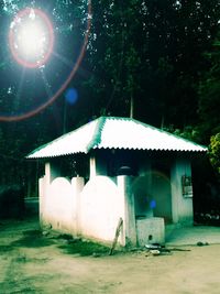 Built structure on field against building