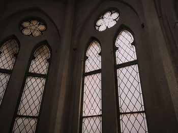 Low angle view of building seen through window