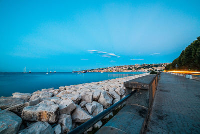 Scenic view of sea against blue sky