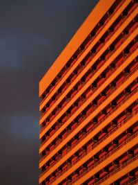 Low angle view of illuminated building against sky at night