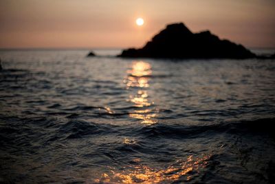 Scenic view of sea at sunset