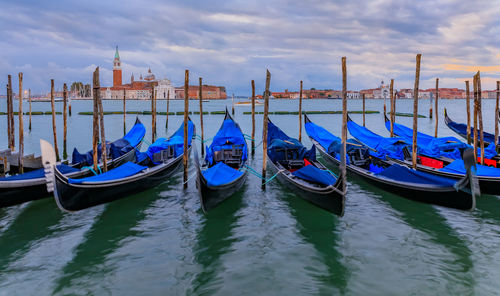 Boats moored at harbor