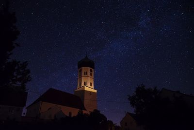 Low angle view of building against sky at night