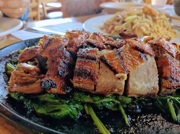 Close-up of roasted duck served on table