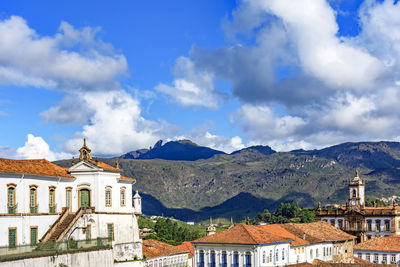 Historic buildings and baroque churches in the city of ouro preto in minas gerais with the mountains