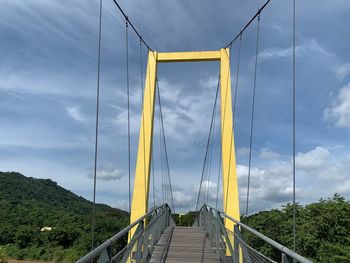 Footbridge against sky