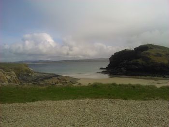 Scenic view of sea against cloudy sky