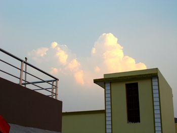 High section of building against sky at sunset