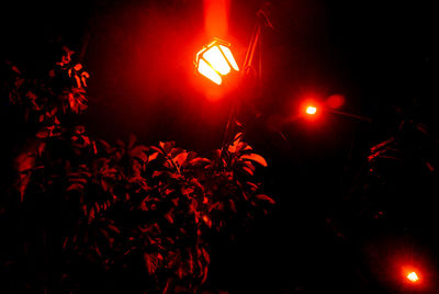 Low angle view of illuminated lights at night