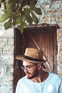 Portrait of young man wearing hat