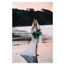 Portrait of woman standing against plants