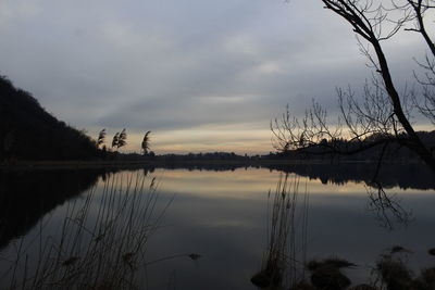 Scenic view of lake against sky during sunset