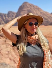 Portrait of young woman wearing sunglasses