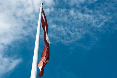 Low angle view of flag against sky