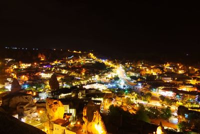 High angle view of illuminated buildings in city at night