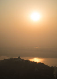 Silhouette of church at sunset