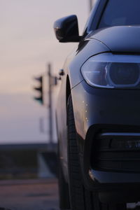 Close-up of vintage car on road