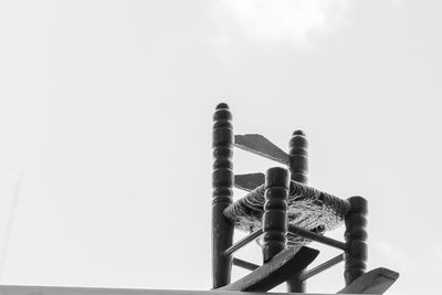 Close-up of metal structure against sky