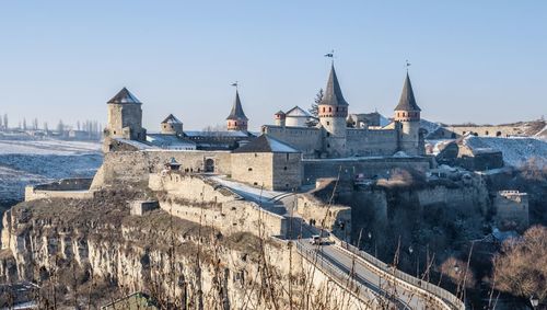 Panoramic view of the kamianets-podilskyi fortress on a sunny winter morning