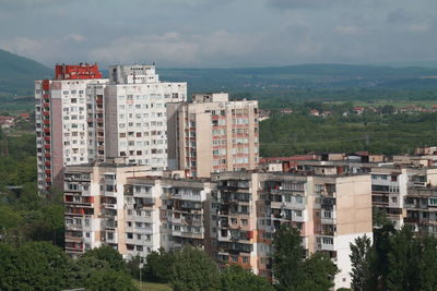 Buildings in city against sky