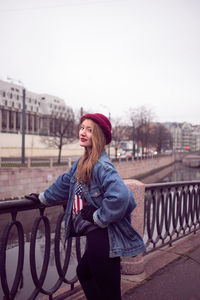 Portrait of woman standing in city