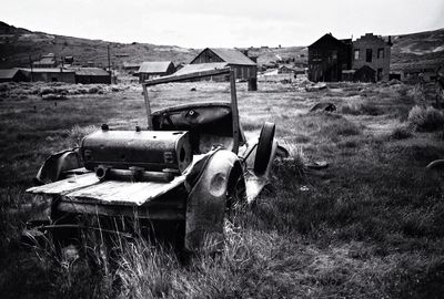 Old abandoned house on field