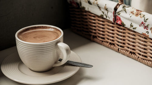 High angle view of coffee cup on table