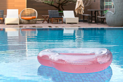 High angle view of drink on table at swimming pool