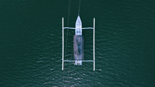 High angle view of sailboat hanging on sea