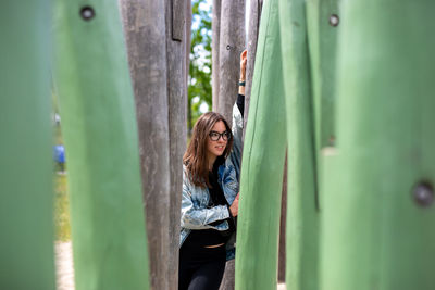 Portrait of smiling young woman standing outdoors