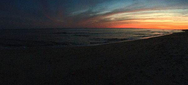 Scenic view of sea at sunset