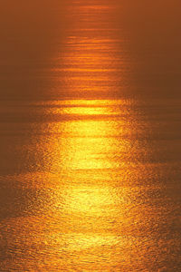Reflection of sun shining on sea