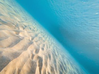 High angle view of surf on beach