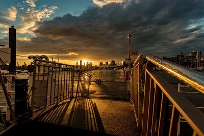 View of bridge over river against cloudy sky